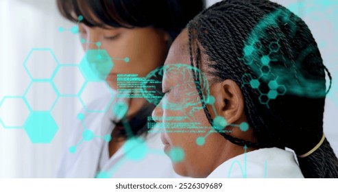 Image of medical data processing over two diverse female scientists working at laboratory. Medical research and science technology concept - Powered by Shutterstock - Get 15% off with code: PIKWIZARD15