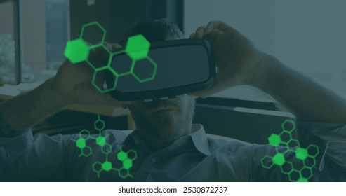 Image of medical data processing over businessman wearing vr headset. global science, digital interface, technology and networking concept digitally generated image.