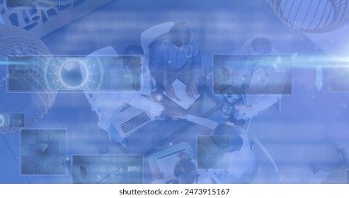 Image of medical data processing and scopes scanning on screens over doctors in meeting. global medicine and science concept digitally generated image.