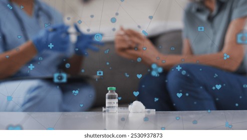 Image of medical icons over african american female doctor with patient. senior home hangout and digital interface concept digitally generated image. - Powered by Shutterstock