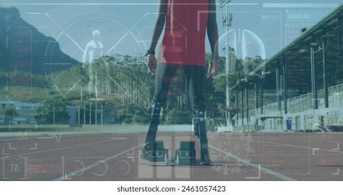 Image of medical processing over low section of male athlete with prosthetic leg on sports field. Sports and technology concept - Powered by Shutterstock