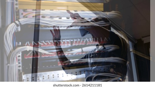 Image of men using vr headset over server room. global connections, business, digital interface, technology and networking concept digitally generated image.