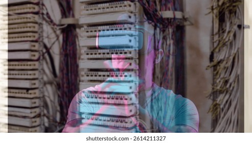 Image of men using vr headset over server room. global connections, business, digital interface, technology and networking concept digitally generated image.