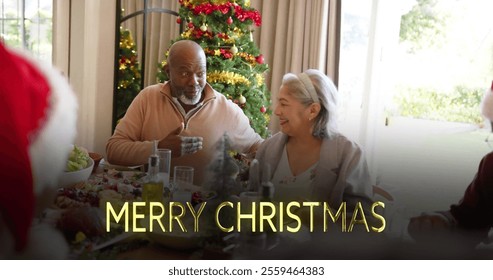 Image of merry christmas text over diverse senior friends at christmas dinner at home. Chirstmas, celebration and tradition concept digitally generated image. - Powered by Shutterstock