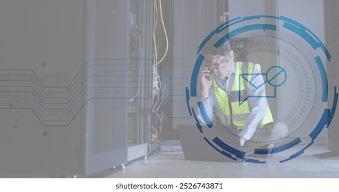 Image of message block icon against asian male engineer talking on smartphone at server room. Cyber security and business data storage technology concept