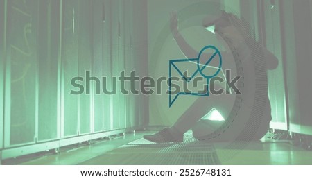 Image of message block icon over asian male engineer wearing vr headset at server room. Cyber security and business data storage technology concept