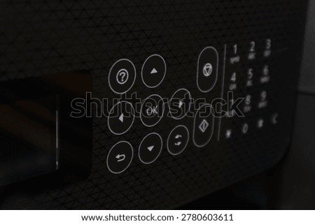 Image of a microwave control panel showing buttons and digital display for operation control.