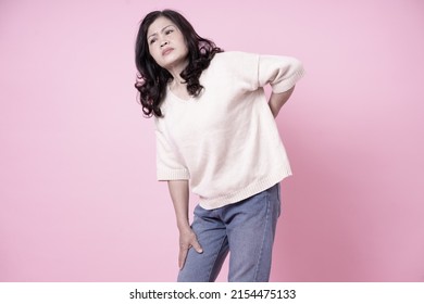 Image Of Middle Aged Asian Woman On Pink Background