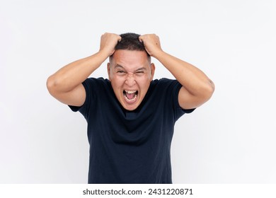 An image of a middle-aged Asian man displaying extreme stress and going amok, frantically pulling his hair, isolated on a white background.