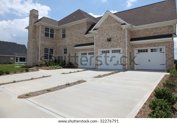 Image of a million dollar modern middle Tennessee\
Home. Three car garage\
entry.