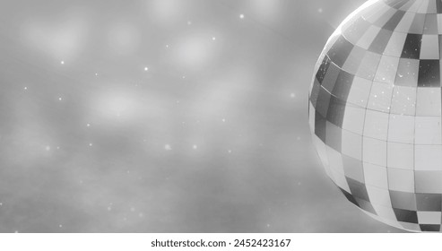 Image of mirror disco ball spinning over spots of lights on grey background. New year's eve, party, tradition and celebration concept digitally generated image. - Powered by Shutterstock