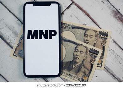 Image of MNP and money for cell phones in Japan. - Shutterstock ID 2396322109