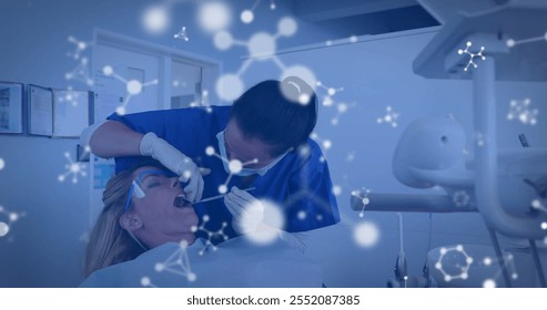 Image of molecules over diverse female dentist and patient. Global medicine, healthcare and digital interface concept digitally generated image. - Powered by Shutterstock