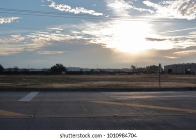 Image Of The Morning Sun Finally Breaking Free Of The Clouds To Shine Upon A Winter Field .