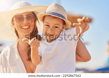 Image of mother and happy son on the beach