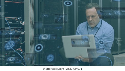 Image of moving screens over caucasian male server room worker. Global science, connections, data processing and digital interface concept digitally generated image.