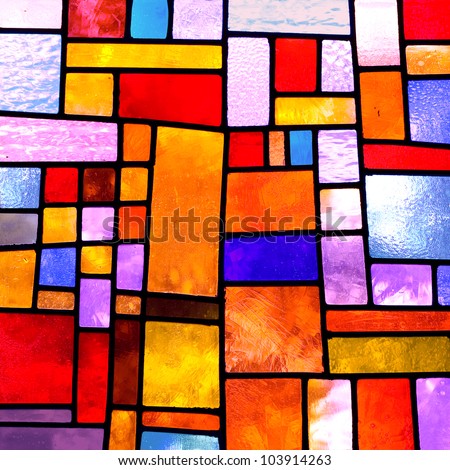 Image of a multicolored stained glass window with irregular block pattern , square format