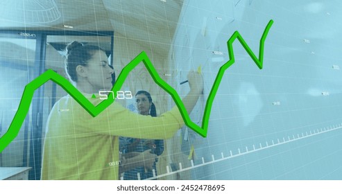 Image of multiple graphs and changing numbers, diverse coworkers writing on whiteboard in office. Digital composite, multiple exposure, report, business, growth and profit concept.