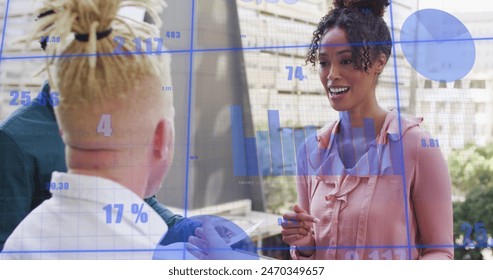 Image of multiple graphs with changing numbers, diverse coworkers discussing reports in office. Digital composite, multiple exposure, report, business, planning, growth and teamwork concept.