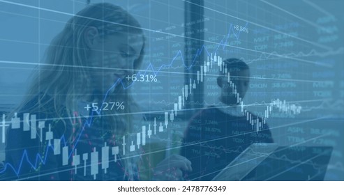 Image of multiple graphs moving over caucasian businesswoman using digital tablet in office. Digital composite, business, report, progress, working, wireless technology, touch screen.