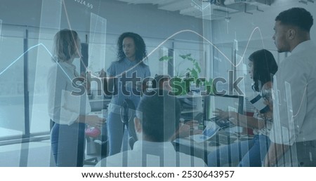 Image of multiple graphs over diverse coworkers with tablets discussing reports in meeting. Digital composite, multiple exposure, report, office, teamwork, communication and technology concept.