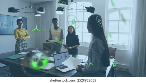 Image of multiple icons over diverse female coworkers discussing reports in office. Digital composite, multiple exposure, business, radiation, planning, teamwork and technology concept. - Powered by Shutterstock