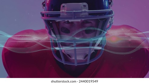 Image of multiple light trails over american football player on neon background. Sports and communication concept digitally generated image. - Powered by Shutterstock