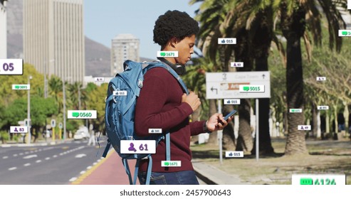 Image of multiple notification bars over biracial man holding cellphone crossing street. Digital composite, multiple exposure, business, growth, social media reminder and technology concept. - Powered by Shutterstock