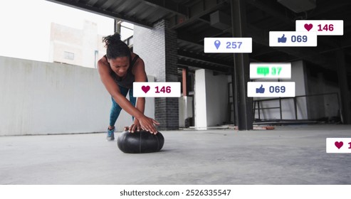 Image of multiple notification bars over african american woman doing push ups in gym. Digital composite, multiple exposure, business, social media reminder, exercise and training concept.