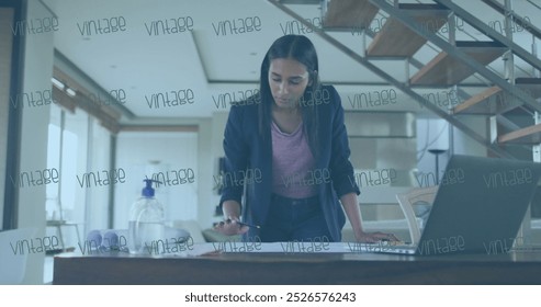 Image of multiple vintage text banners against biracial woman working on a plan at office. Business technology concept - Powered by Shutterstock