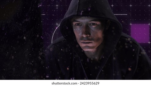 Image of neon shapes over caucasian male hacker. Network, data security, cyber crime and technology concept digitally generated image.