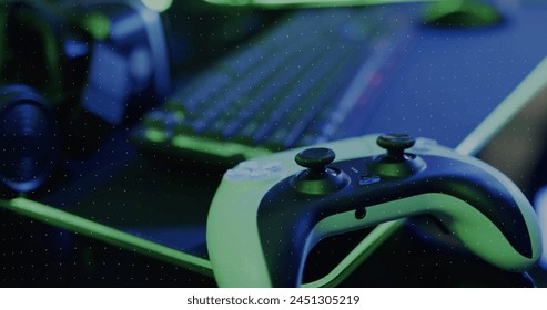 Image of neon shapes over image game computer equipment. Global image game, digital interface, data processing and connections concept digitally generated image. - Powered by Shutterstock