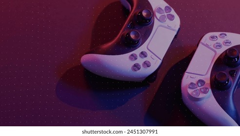 Image of neon shapes over image game computer equipment. Global image game, digital interface, data processing and connections concept digitally generated image. - Powered by Shutterstock