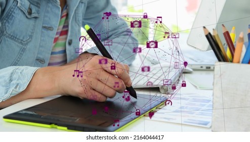 Image of network of connection with interface icons forming a globe over woman using digital graphic tablet. Global networking design concept digital composite.