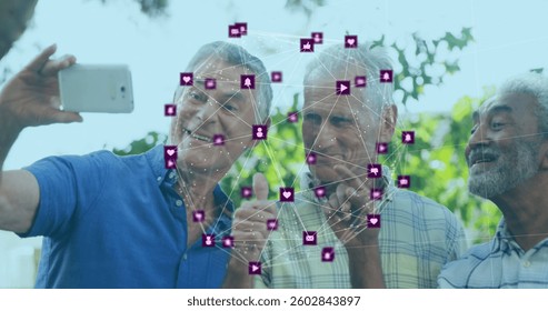 Image of network of connection with interface icons over three senior men taking selfies. global networking concept digital composite. - Powered by Shutterstock - Get 15% off with code: PIKWIZARD15