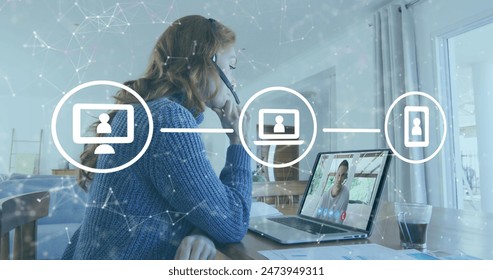 Image of network of connections with icons over businesswoman using phone headset and laptop. global networks, data processing, digital interface and technology concept digitally generated image.