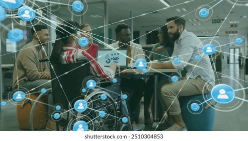 Image of network of connections with icons over disabled and diverse colleagues at meeting. Technology, business and digital interface concept digitally generated image. - Powered by Shutterstock