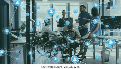 Image of network of connections with icons over disabled and diverse colleagues at meeting. Technology, business and digital interface concept digitally generated image. - Powered by Shutterstock