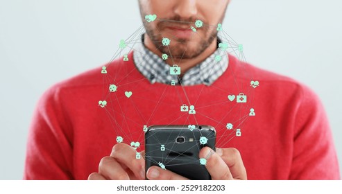 Image of network of connections with icons over caucasian man using smartphone. Global connections, communication, technology and data processing concept digitally generated image.