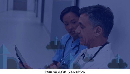 Image of network of connections with icons over diverse doctors using tablet. Global communication, business, connections, computing and data processing concept digitally generated image. - Powered by Shutterstock