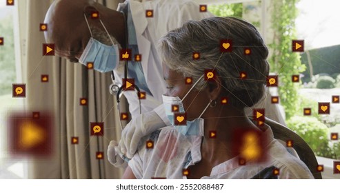 Image of network of connections with icons over senior african american woman and male doctor. Global medicine, healthcare, connections and digital interface concept digitally generated image. - Powered by Shutterstock