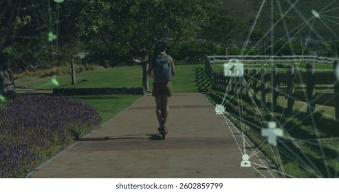 Image of network of connections with medical icons over woman driving scooter in park. Digital interface global sport and performance concept digitallygenerated image.