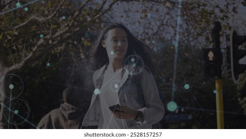 Image of network of connections over biracial woman using smartphone. Global technology, connections and digital interface concept digitally generated image. - Powered by Shutterstock