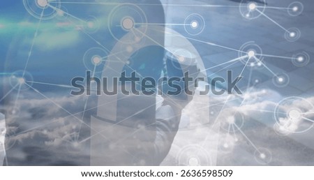 Image of network of connections over clouds and midsection of africanamerican businessman. Business, network, connections and communications concept digitally generated image.