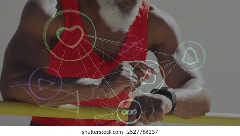 Image of network of connections over senior african american man using smartwatch at beach. healthy, active lifestyle, connections and digital interface concept digitally generated image. - Powered by Shutterstock