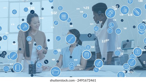 Image of network of digital icons over three diverse women discussing together at office. Global networking and business technology concept - Powered by Shutterstock