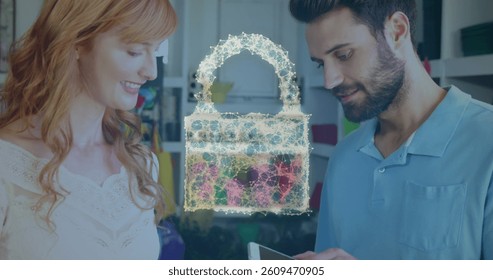 Image of network security padlock over people using payment terminal. global communication and data security concept digitally generated image.