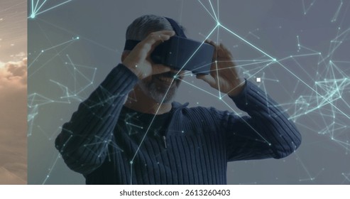 Image of networks of connections and digital human brain over man wearing vr headset. global data processing, computing and digital interface concept digitally generated image.