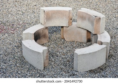 An Image Of New Concrete Blocks Set Up To Form A New Backyard Firepit. 