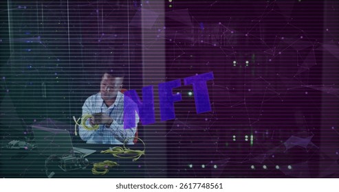 Image of nft text over african american male worker in server room. global technology and digital interface concept digitally generated image.